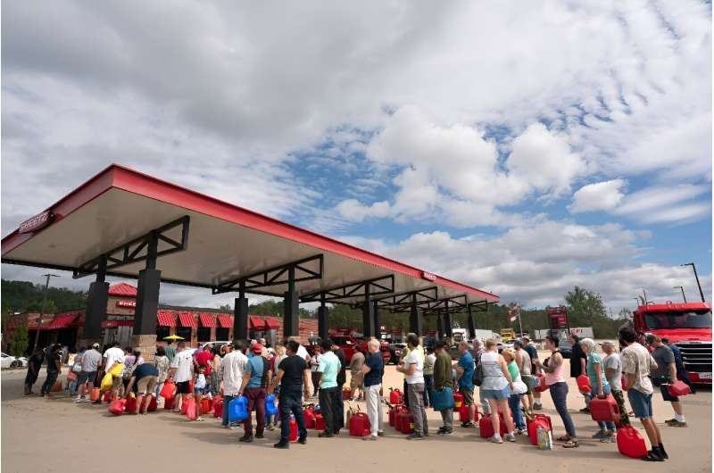 People wait in line for gasoline in the aftermath of Hurricane Helene on September 29, 2024 in Fletcher, North Carolina