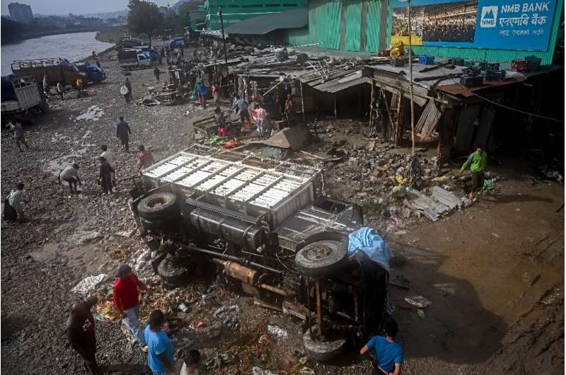 Entire neighbourhoods in Kathmandu were inundated after the heaviest rains in more than two decades